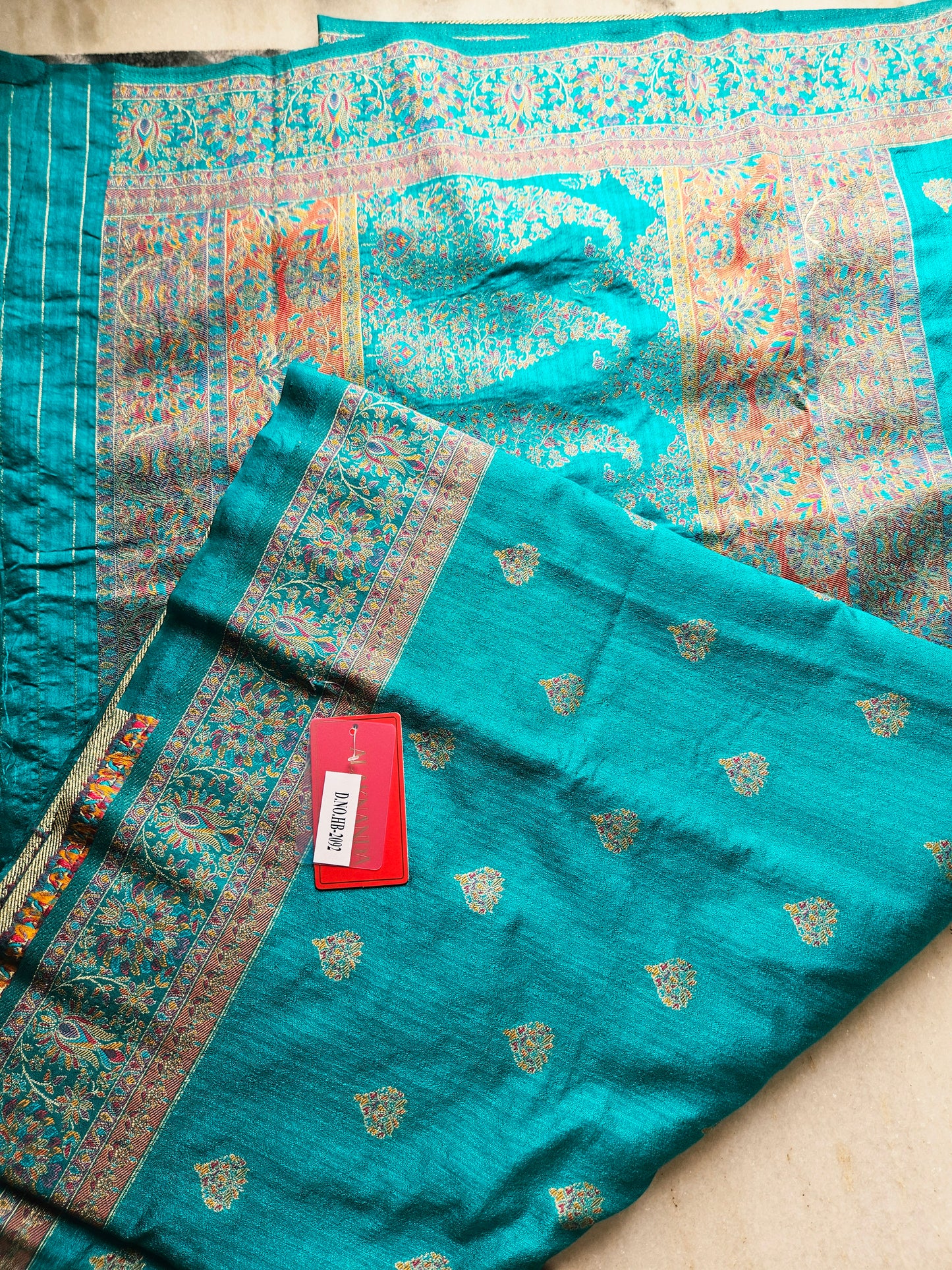 Premium Khaddi Silk Saree in Turquoise with Zari Buttis & Multicolor Kani Border