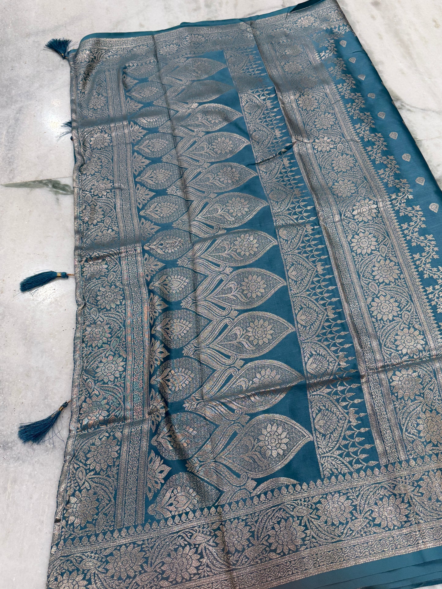 Kaya Kalpo Teal Blue Satin Weave Saree | Gold Zari Booti Body & Large Leaf Woven Pallu | Festive & Bridal Wear